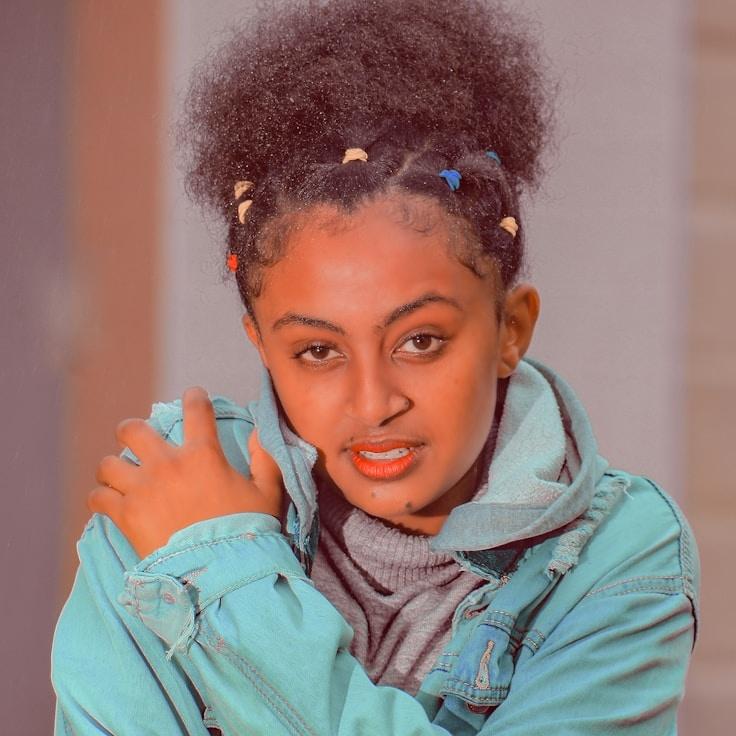 Kaveri Mehta, Lead Design Curator at Meadow Chain Link, reviewing corporate floral arrangements